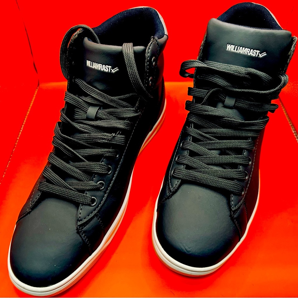 One new pair of William Rast hi-top sneakers size 11. Dark matte gray.